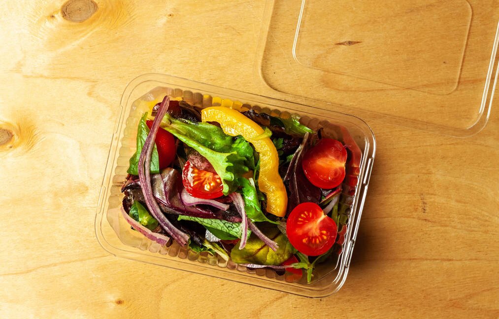 Salad Boxes Vegetable salad in a plastic box with plastic fork